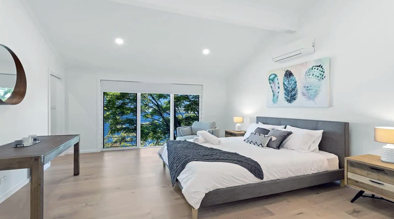 New Master Bedroom, replacing the existing lounge room. The existing sliding door is replaced with windows, and no longer has balcony access, and there is walk-in-wardrobe to the left